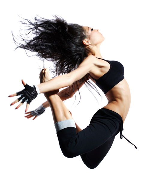 modern style dancer jumping behind studio background