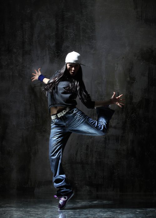 modern style dancer jumping on dirty grunge background